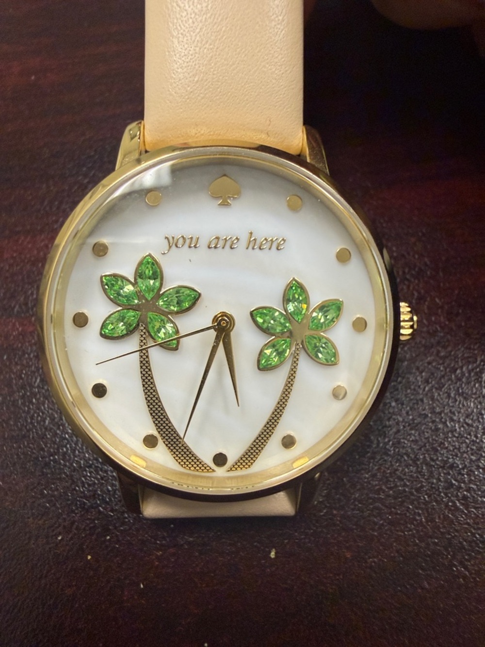 kate spade gold-tone watch with green crystal palm accents and cream strap